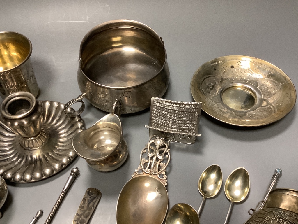 A late 19th century Russian gilt 84 zolotnik tea cup and saucer, dated 1883, a pair of similar salts and a group of other items.